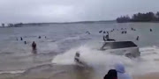 The Range Rover driving through the water at a Richards Bay beach.