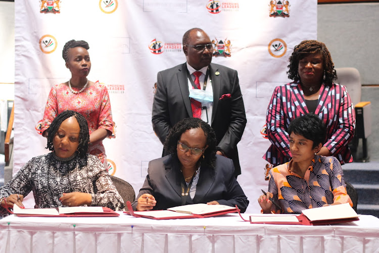 ELF Board member Patience Nyange,Vice chairperson Public Commission Charity Kisotu and Epl board member Sharmi Surianarain signing an MOU during the official launch of the public service Emerging Leaders Fellowship Programme at the KICC Nairobi on Tuesday 23, November