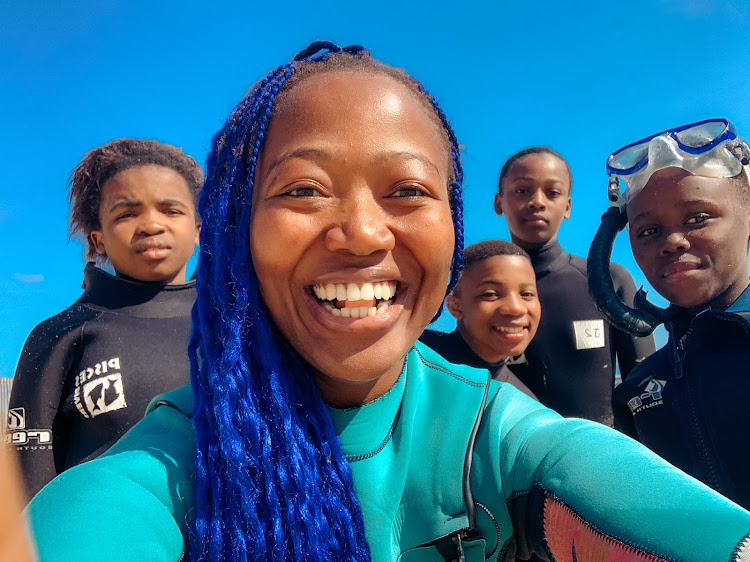 The Black Mermaid, Zandile Ndhlovu, front, is excited about taking youngsters underwater