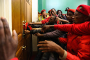 Members of the Economic Freedom Fighters wreaked havoc in the Johannesburg city centre yesterday when they stormed the Gauteng legislature, demanding that their members be allowed back into the house.