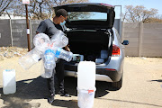 Ricky Nelson with his water containers.