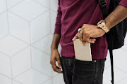 The man was wearing two pairs of trousers. Six cellphones were found concealed in the second pair and he was arrested. Stock photo.