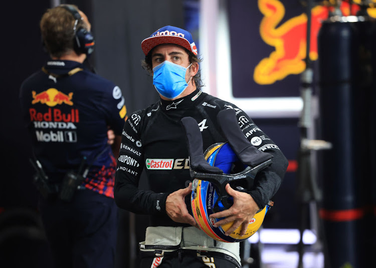 Fernando Alonso walks in the pit lane during qualifying ahead of the F1 Grand Prix of Saudi Arabia at Jeddah Corniche Circuit on December 4 2021.