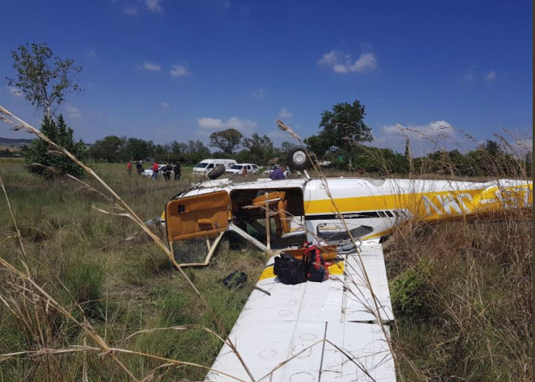 Three people sustained minor injuries when the light aircraft they were travelling in crashed.