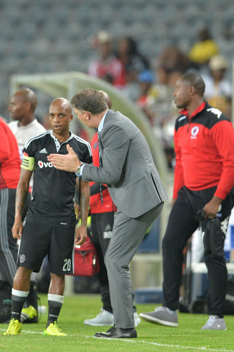 Orlando Pirates head coach Kjell Jonevret and Oupa Manyisa during the Absa Premiership match between Orlando Pirates and SuperSport United at Orlando Stadium in Johannesburg, South Africa.