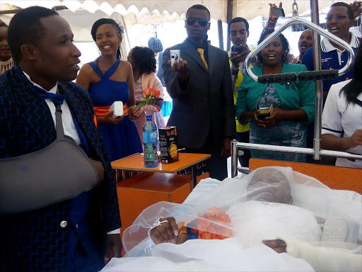 Bridegroom James Mwangi (left) and bride Miriam Gakenia at Outspan Hospital in Nyeri town on Saturday. Photo/Wambugu Kanyi