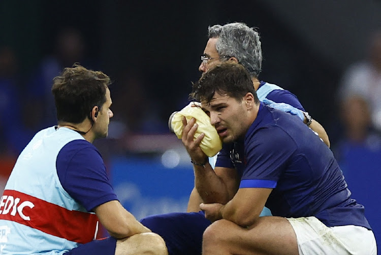 France's Antoine Dupont receives medical attention after sustaining an injury in their 2023 Rugby World Cup pool A game against Namibia at Stade Velodrome in Marseille on September 21.