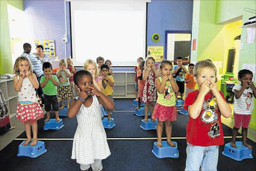 LEARNING IS GROWING: In front, Elo Nene and James Marais, along with the rest of their class at Hudson Park Eaglets, enjoy a NeuroNet session. The school has implemented Neuronet to assist the children with many different skills Picture: STEPHANIE LLOYD