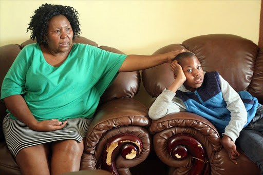 Vosloorus, July 31. Prudence Molefe with her son Kagiso Molefe,11, who allegedly suffered a permanent injury when he was born. He allegedly fell from the bed after his mother gave birth to him at Natalspruit Hospital in 2005. PHOTO:ANTONIO MUCHAVE/SOWETAN