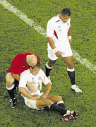 JONNY CALLS THE DENTIST: Jonny Wilkinson down and out but not off during the 2003 World Cup