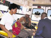 INJURED:Hawkers receiving medical attention from health workers after injured during the clash with police. Pic: Chester Makana. 04/08/2009. © Sowetan