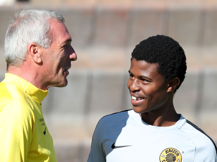 Kaizer Chiefs head coach Ernst Middendorp shares a joke with his exciting young midfielder Happy Mashiane during a session at their training base in Johannesburg on May 15 2019.
