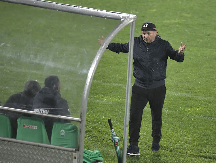 Jozef Vukusic throws his hand in the air in frustration during a match.