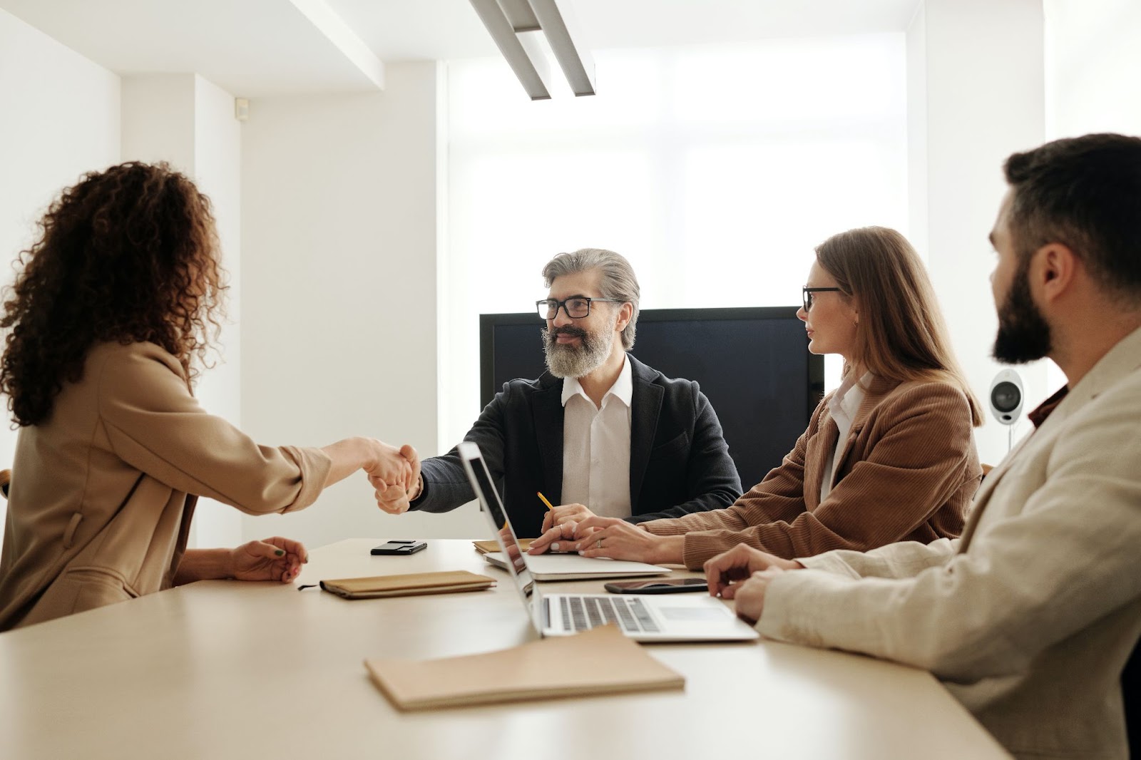 a company meeting that shows an agreement for an animator having a secure and stable position 