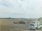 A view from inside a vehicle shows emergency services personnel responding to a helicopter crash near La Grulla, Texas, United States, March 8, 2024. 