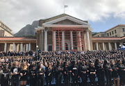 Students and staff dressed in black fill Sarah Baartman Plaza at the University of Cape Town on September 4 2019 in memory of murdered student Uyinene Mrwetyana. 