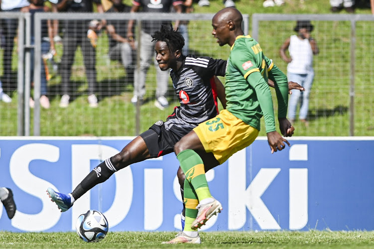 Orlando Pirates' Karim Kimvuidi beats marker Themba Mantshiyane of Lamontville Golden Arrows in the DStv Premiership match at Mpumalanga Stadium in Hammersdale, outside Durban on Sunday.