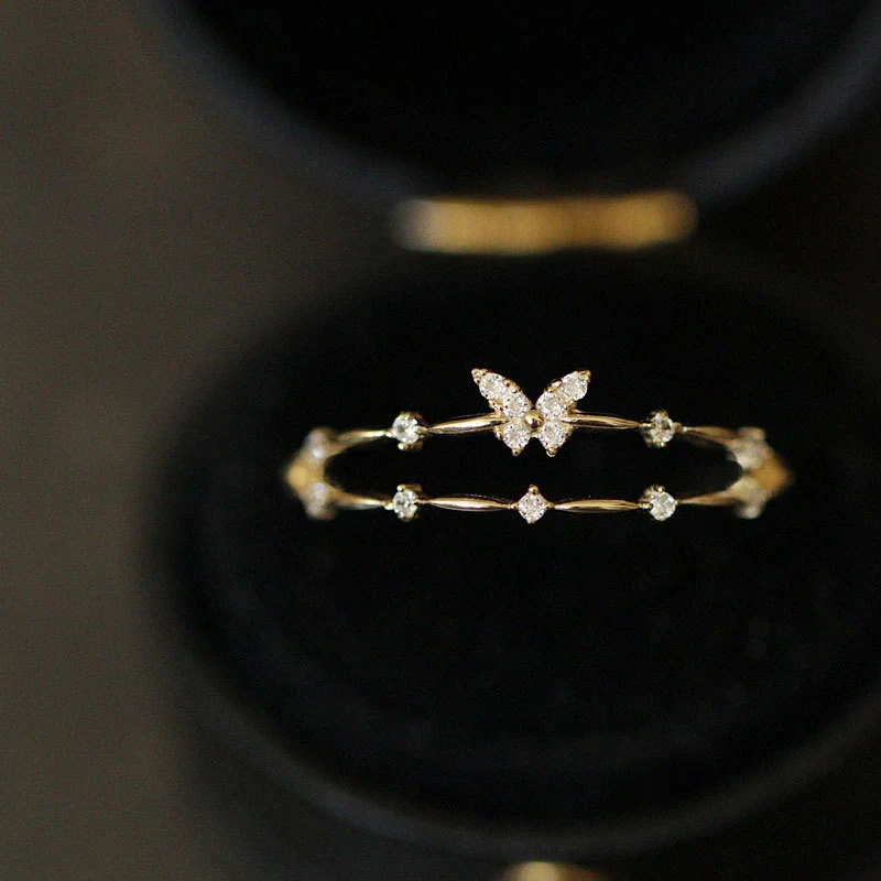 Bague coréenne exquise en argent sterling S925, design double couche papillon avec petits diamants, pour un style féminin et raffiné.
