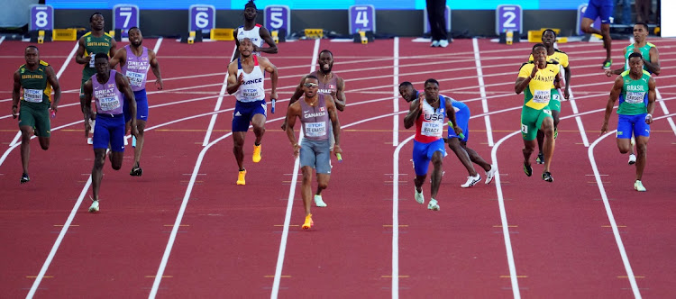 Canada's Andre De Grasse, Marvin Bracy of the US and Britain's Reece Prescod in action during the men's 4x100m relay final. Akani Simbine is on the far left.