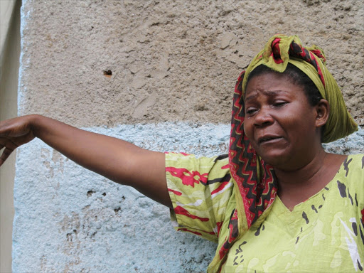 A woman mourns after her son was killed during gunfire in the Nyakabiga neighbourhood of Burundi's capital Bujumbura, December 12, 2015. Photo/REUTERS