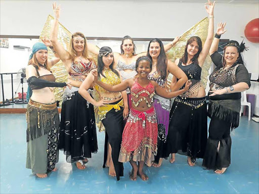 TUMMY TALK: Belly dancing enthusiast Rachelle Scott, far right, and the Desert Divas will perform in the Belly Dance Extravaganza at the Guild Theatre on May 27. Studios from all over South Africa will perform