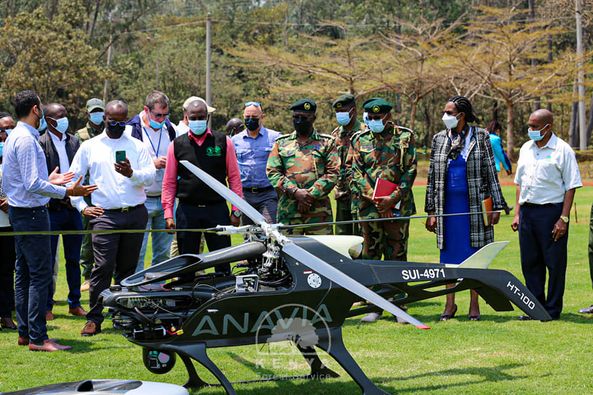 KFS Board chairman Peter Kinyua and CCF Julius Kamau are taken through how a drone works.