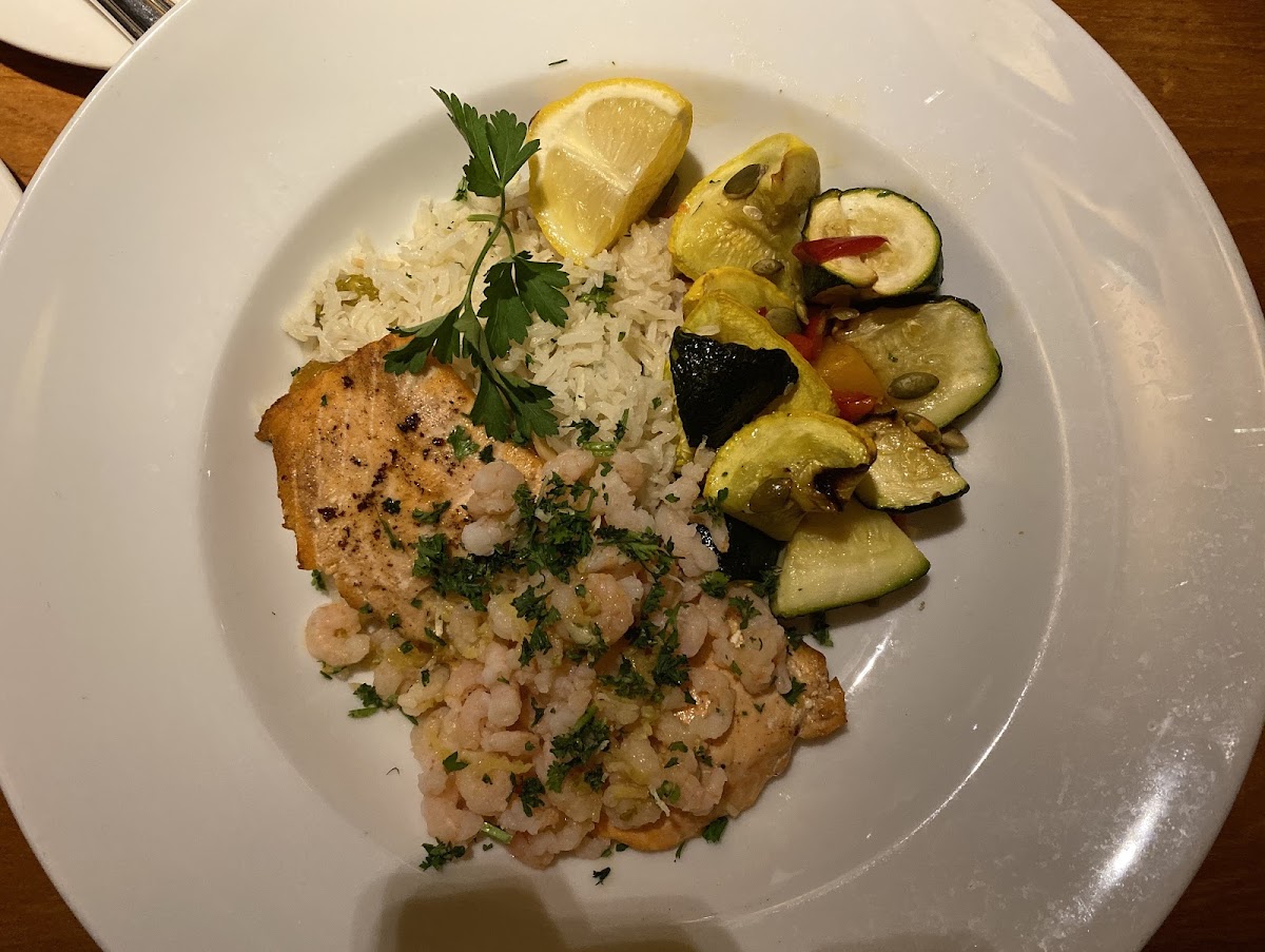 “Northwest Duet”— Salmon with Oregon Shrimp, rice and sautéed zucchini. On the early dinner menu comes with appetizer, salad and dessert.