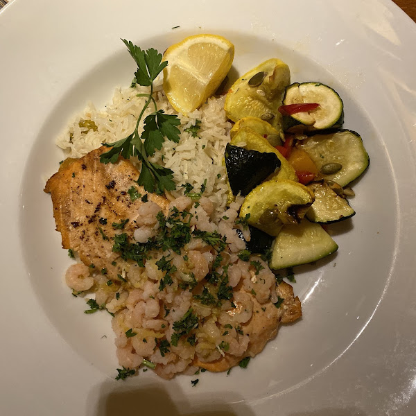 “Northwest Duet”— Salmon with Oregon Shrimp, rice and sautéed zucchini. On the early dinner menu comes with appetizer, salad and dessert.