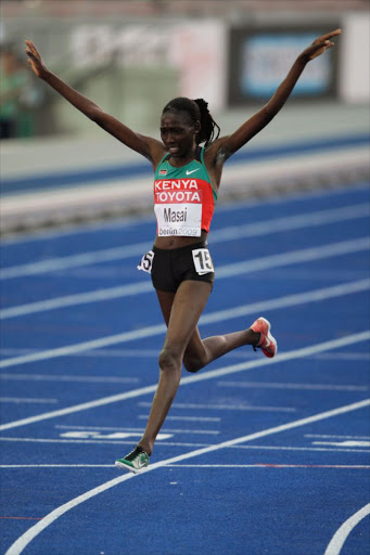 Linet Chepkwemoi Masai of Kenya celebrates winning the gold medal in the women's 10,000 metres final during day one of the 12th IAAF World Athletics Championships at the Olympic Stadium on August 15, 2009 in Berlin, Germany