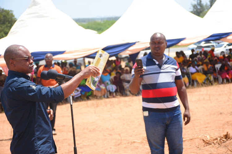 Governor Amason Kingi talks at past function in Magarini as James Mulei records