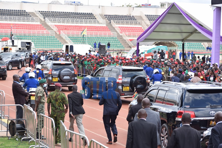 Kenyans attending Labour day celebrations at Nyayo stadium gestures at Uhuru Kenyatta's motorcade as it exists shortly after the ceremony on May 1, 2022