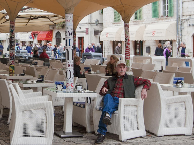 A patron relaxes at Caffe Bar Forza in Kotor's Old Town. 