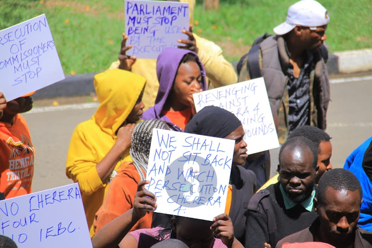 Protests outside Parliament where proceedings of the petitions to remove four IEBC commissioners are on going on November 28.