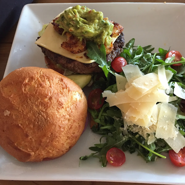 Daily special burger: blackened shrimp and guacamole topped burger. Side rocker salad.