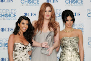 FILE IMAGE:  Reality television sisters (L-R) Kourtney, Khloe and Kim Kardashian pose with their favorite guilty pleasure award for 'Keeping Up with the Kardashians' at the 2011 People's Choice Awards in Los Angeles January 5, 2011.