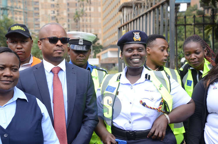 Kenya Police Service SSP Wilfrida Rotich and magistrate Geoffrey Onsarigo during the traffic open day flag off at Milimani Law Courts on March 20, 2024.