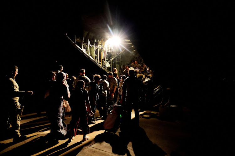 A view of military personnel and some of the last evacuees boarding a RAF aircraft bound for Cyprus, at Wadi Seidna Air Base in Sudan April 29 2023. Picture: UK MOD/ARRON HOARE/REUTERS