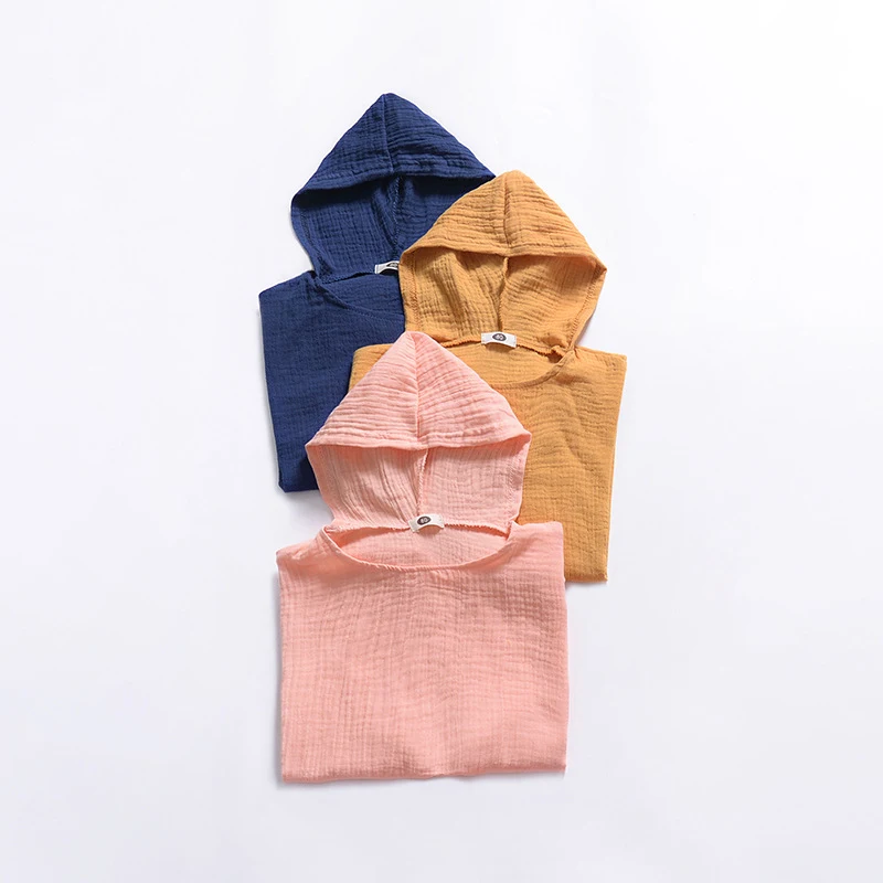 Cape à capuche unisexe pour bébé couleur unie, style Europe et Amérique, parfaite pour garder bébé au chaud et confortable, facile à porter.