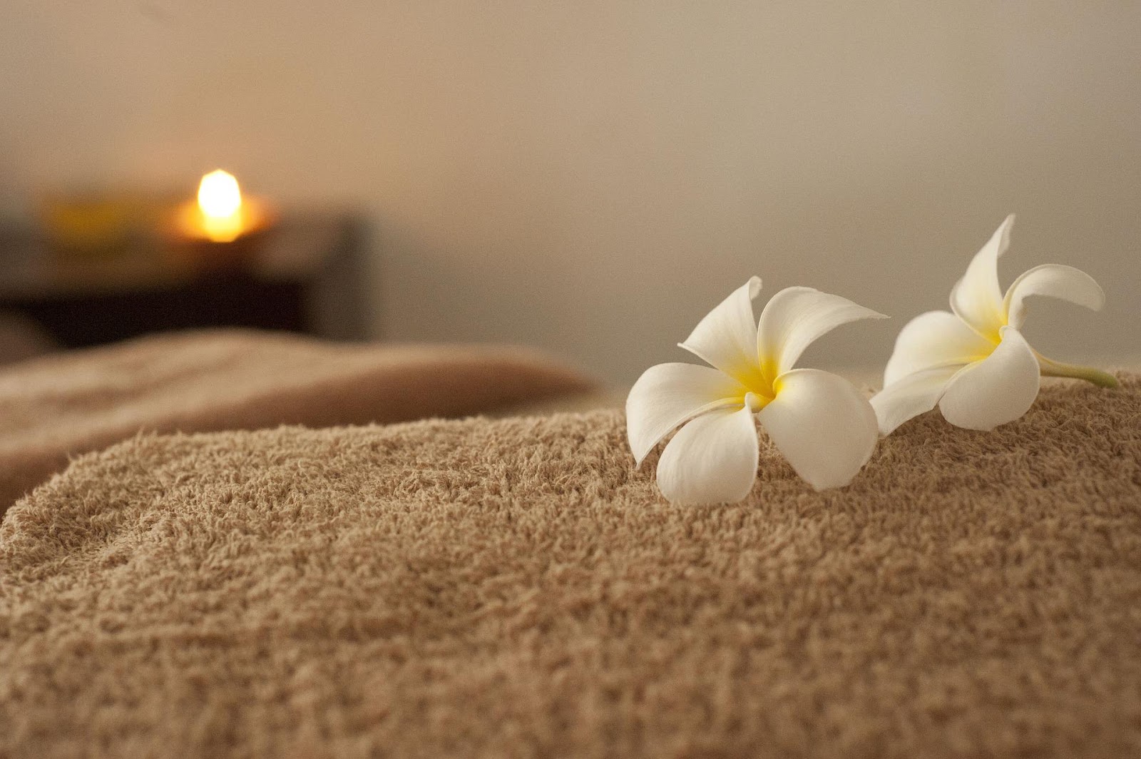 white flowers lying on a towel, stress, health, illness, meditation, shopping, doctor