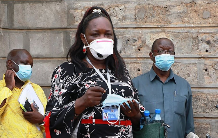 Malaba Port Health Mmanager Evelyn Walela when she recently addressed the media in Busia. She was with Deputy Governor Moses Mulomi (R) and county chief of staff Sebastian Okiring.