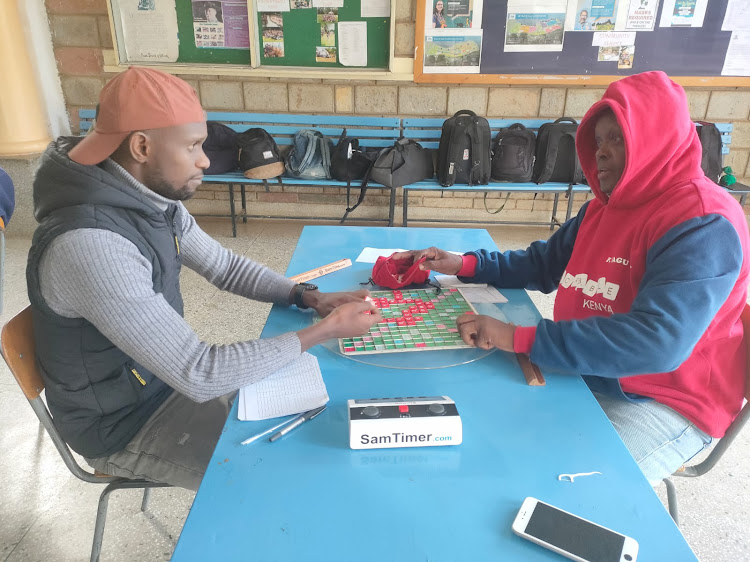 David Kimani (L) during their Scrabble Kenya tournament in Eldoret while playing against Fred Magu. Kimani registered his maiden scrabble win in Jinja, Uganda over the weekend.