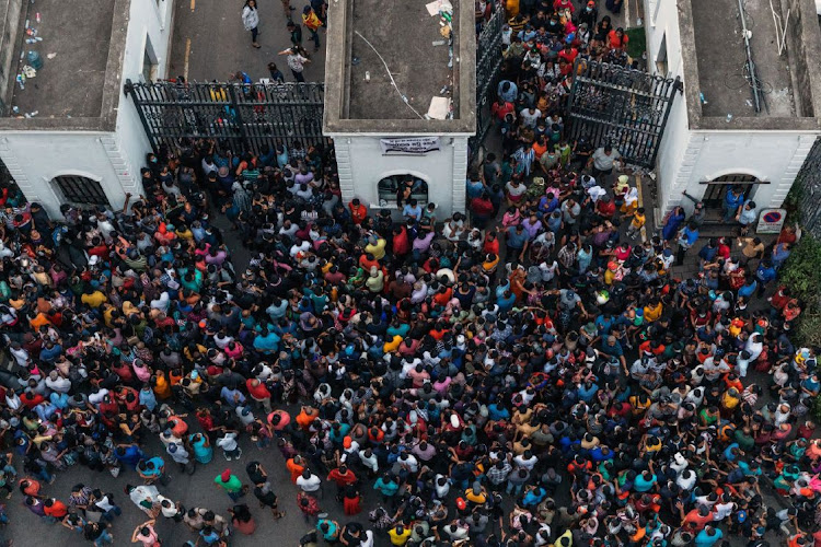 Protesters asking for President Gotabaya Rajapaksa's immediate resignation march in the President's Palace in Colombo, Sri Lanka on Sunday, July 10 2022. Picture: BLOOMBERG/JONATHAN WIJAYARATNE