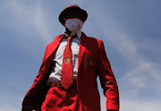 A Cosatu member shows off the colours in Newtown, Johannesburg on Thursday, October 7 2021, as part of a nationwide stay away. Cosatu is protesting against corruption, retrenchments and increasing  job losses across the country. 