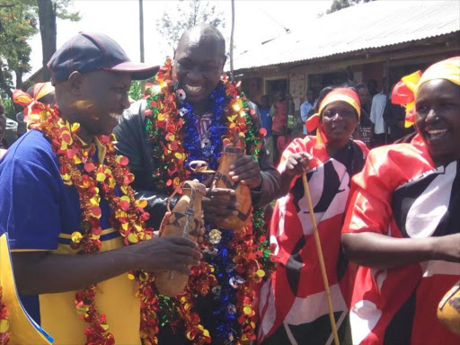 Cheranganyi MP aspirant Joshua Kuttuny with Kenya Power CEO Ken Tarus at Tuigoin, June 26, 2017. /MATHEWS NDANYI