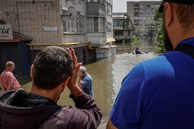 Local residents during an evacuation from a flooded area in Kherson, Ukraine, June 7 2023. Picture: ALINA SMUTKO/REUTERS