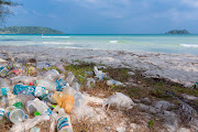 Plastic piles up on a beach.