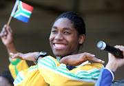 Caster Semenya, at OR Tambo international airport after arriving in South Africa from the IAAF event in Germany. She won the gold medal in the women's 800m dispite the controversy about her gender. South Africans showed support by waiting patiently for her and the rest of the South African Athletics team until she came out to with heavy police protection as the supporters push to tough the golden girl. Pic: Sydney Seshibedi. 25/08/2009. © Sunday Times.