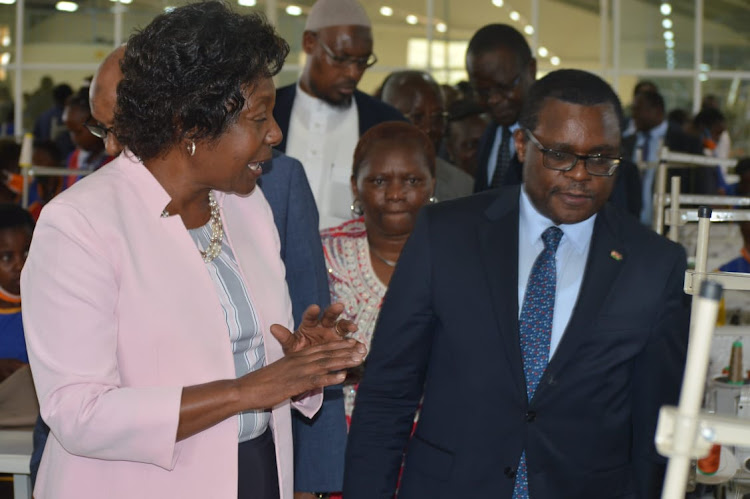 Kitui Governor Charity Ngilu and Senate Speaker Kenneth Lusaka converse after touring Kitui County Textiles in Kitui on September 16