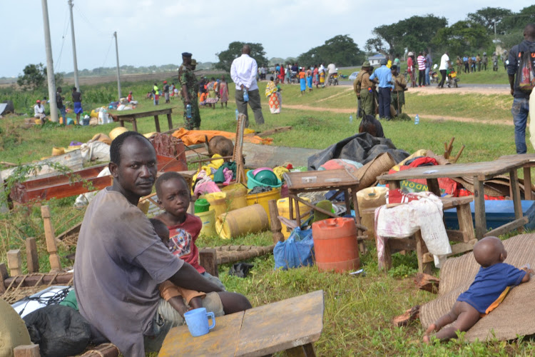 Some of the stranded residents of Kadzuhoni in Magarini with their belongings after a tycoon demolished their properties to take over a disputed 339 acres piece of land on Saturday, December 10, 2022.