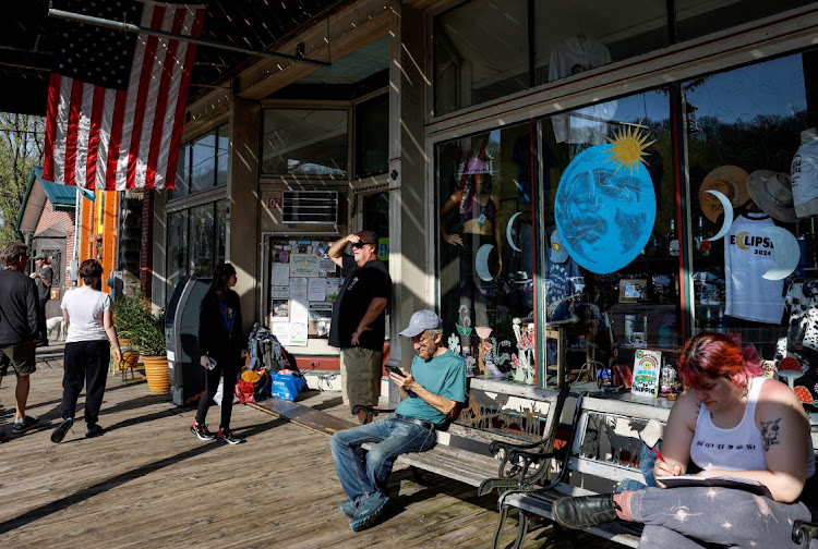 Visitors explore the village of Makanda, population 600, which is at the "crossroads of the 2017 and 2024 eclipses", experiencing full totality for both, in southern Illinois, US, on April 7 2024.